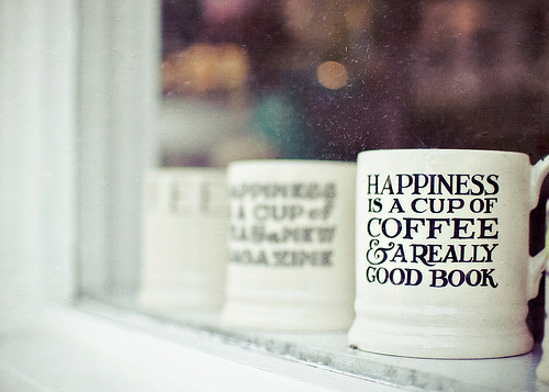 "Happiness is a cup of coffee & a really good book"